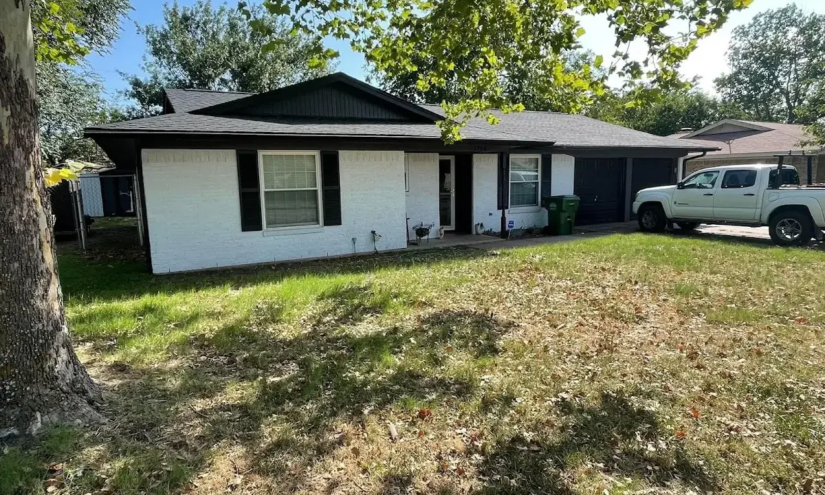 Professional roofing crew working on a residential roof in Claverack